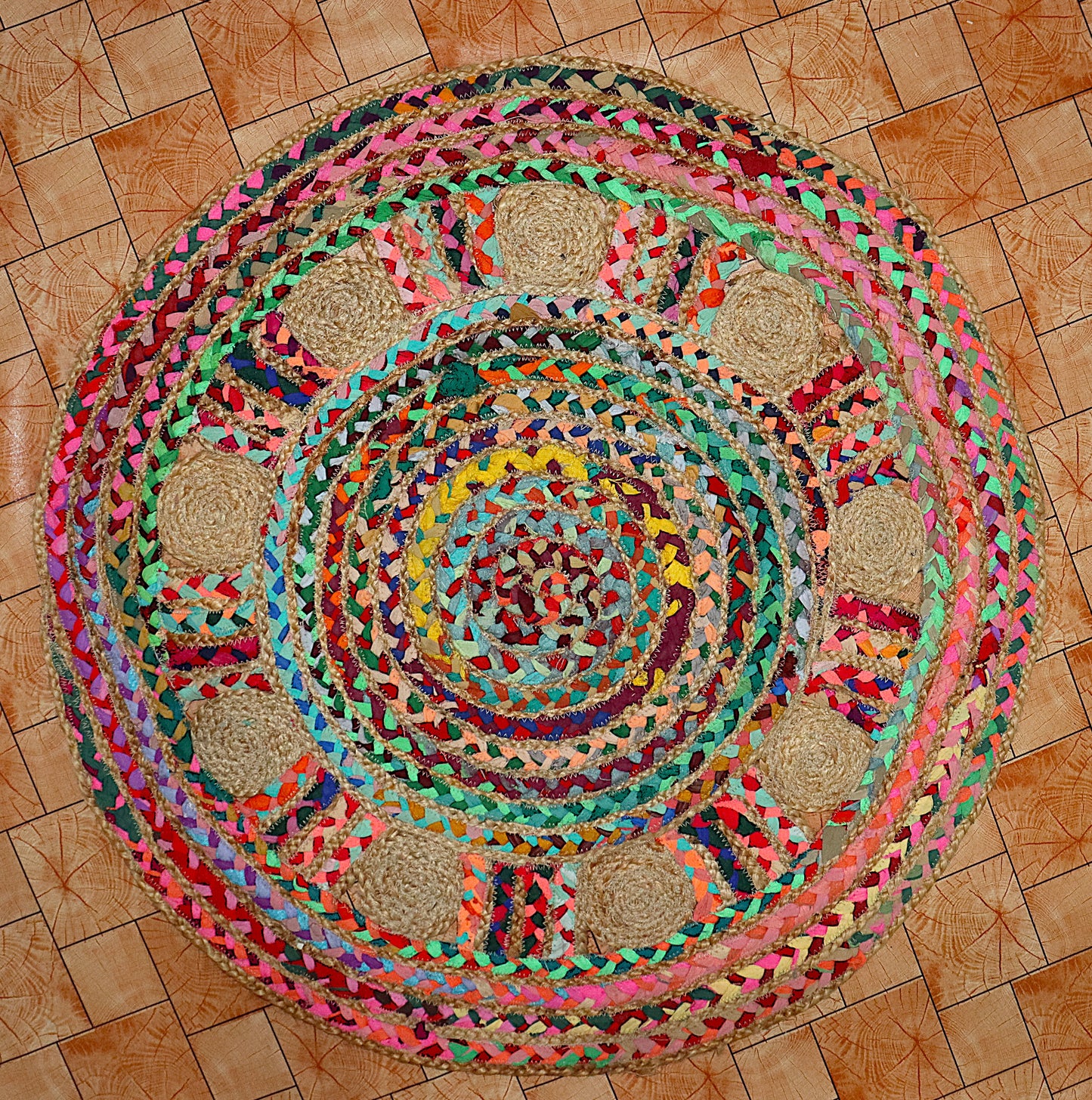 Colorful braided rug on a wooden floor