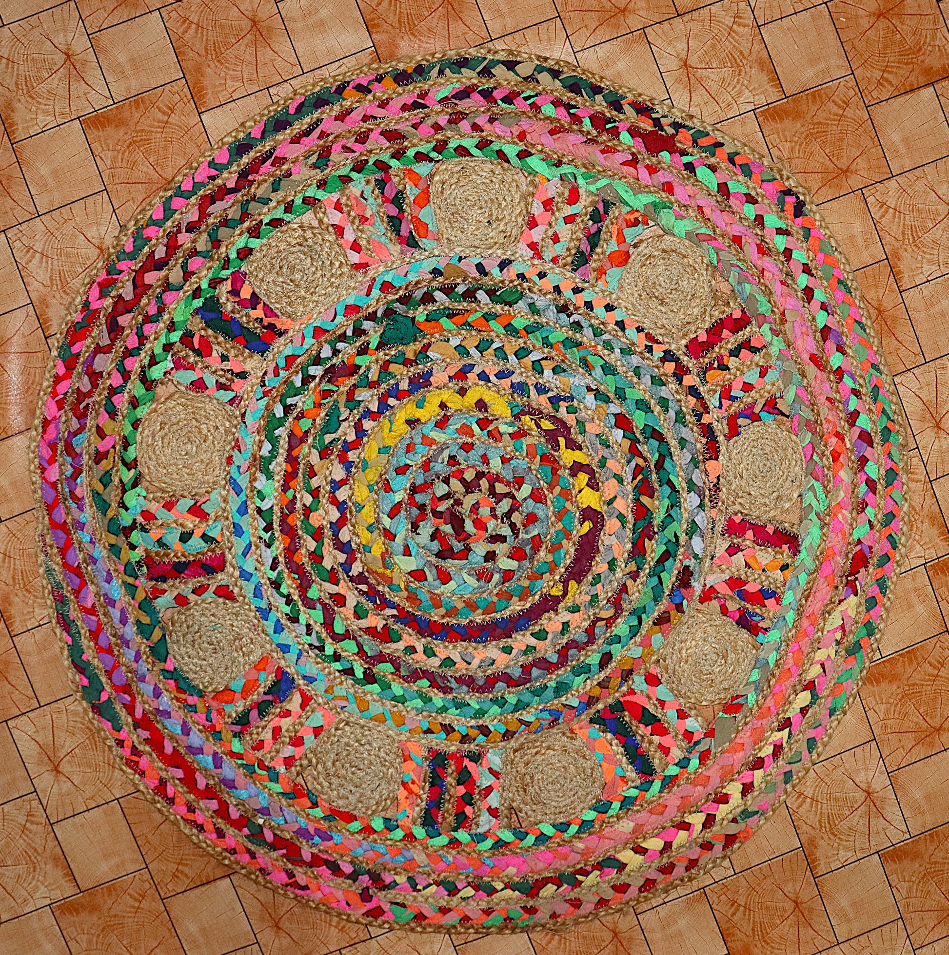 Colorful braided rug on a wooden floor