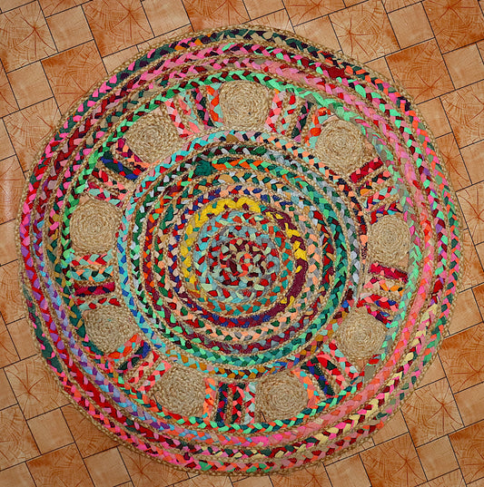 Colorful braided rug on a wooden floor