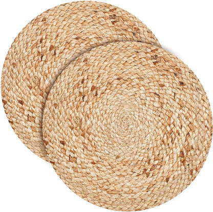 Rustic woven jute table mat paired with elegant dinnerware and candle decor for a cozy and sophisticated dining experience.