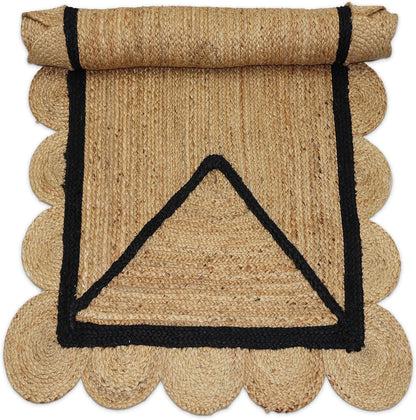 Natural Jute Area Rug with scalloped edges and a black border, suitable for indoor or outdoor use.
