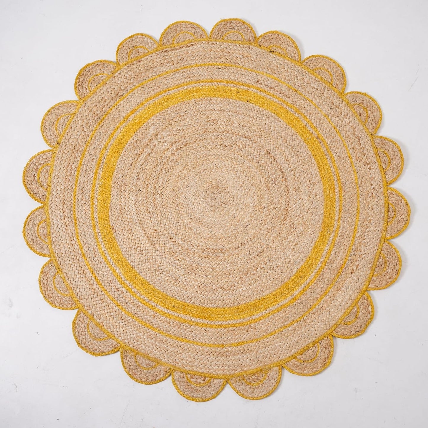 Natural Jute Area Rug with a scalloped yellow border, perfect for adding texture to any living space.