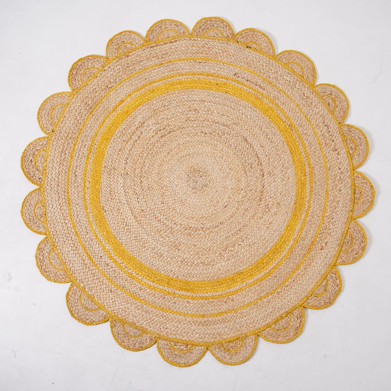 Natural Jute Area Rug with a scalloped yellow border, perfect for adding texture to any living space.
