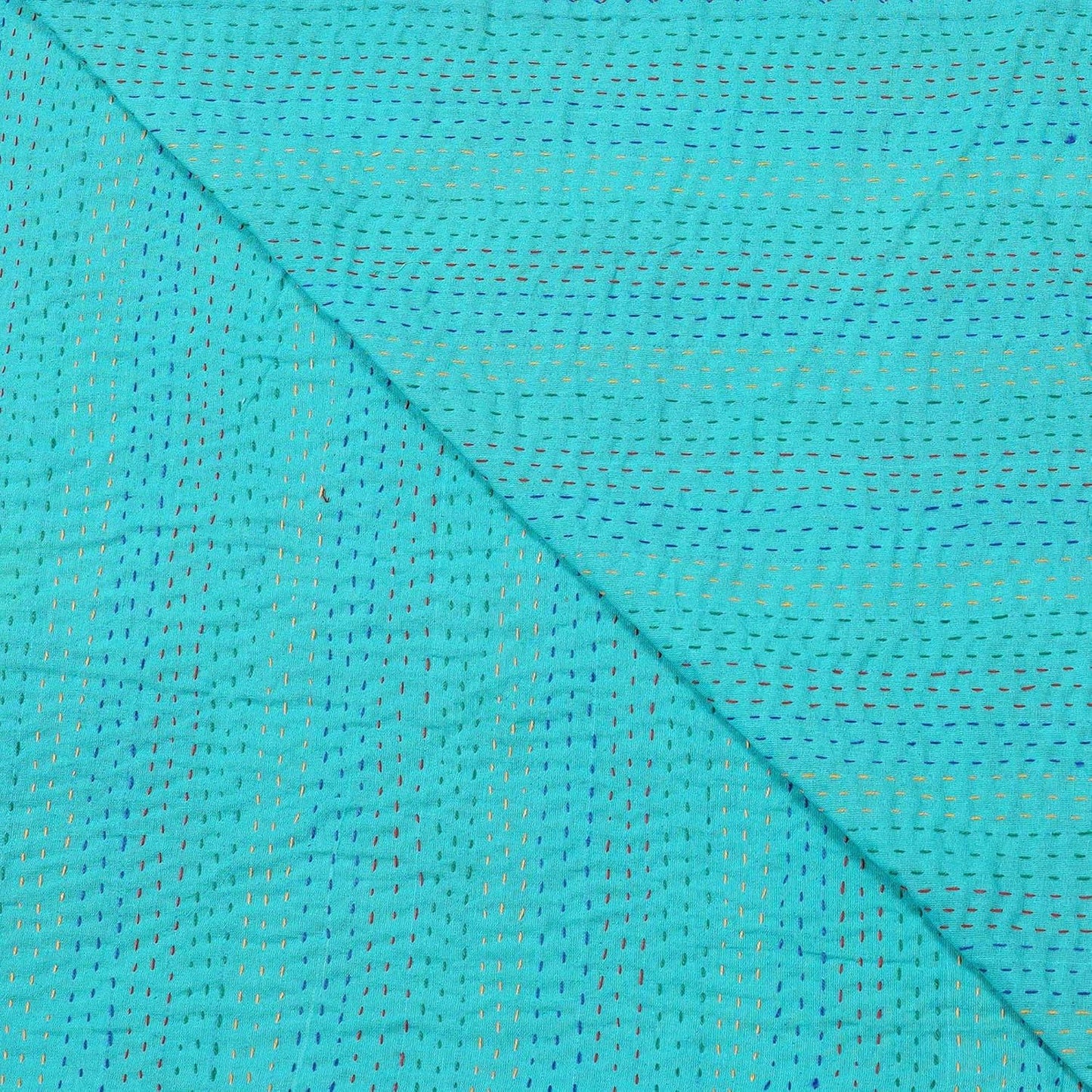 Close-up of turquoise fabric with a subtle pattern