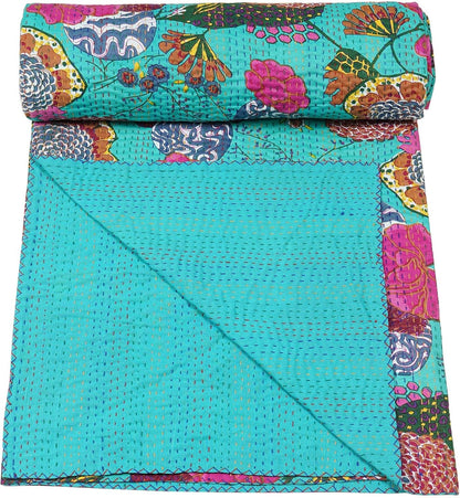 Sea green kantha quilt by Boho Vintage Blanket, with handmade floral pattern and visible stitch texture.