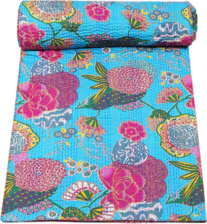 Turquoise Kantha quilt by Handmade Floral Cotton Blanket, featuring a vintage bedspread and floral patterns.

