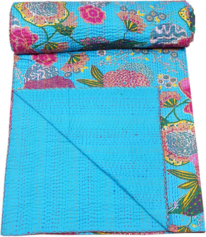 Turquoise kantha quilt by handmade, floral cotton blanket with boho vintage bedspread styling.