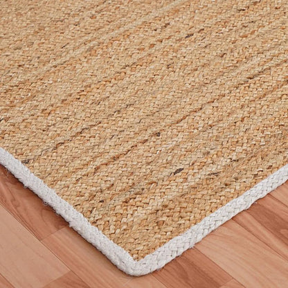 Natural Jute Area Rug beige braided texture with white border corner on wood floor