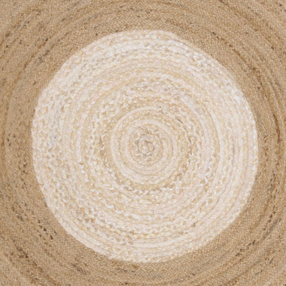 Round woven mat with concentric circle pattern on a textured surface