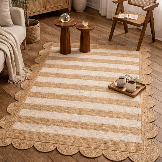 Natural jute rug with striped design and scalloped edges, ideal for cozy living spaces.