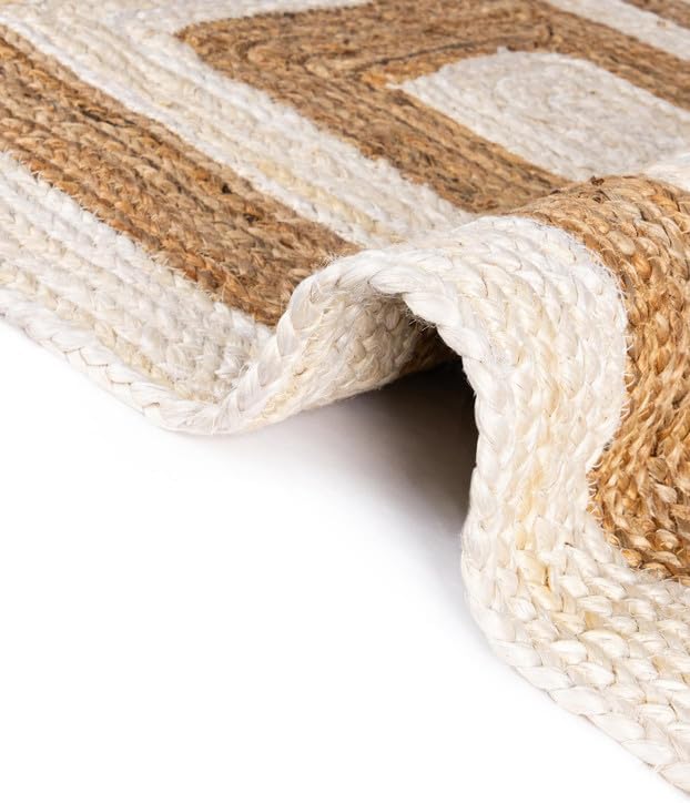 Braided natural fiber rug in beige and brown, perfect for adding warmth and texture to any room.
