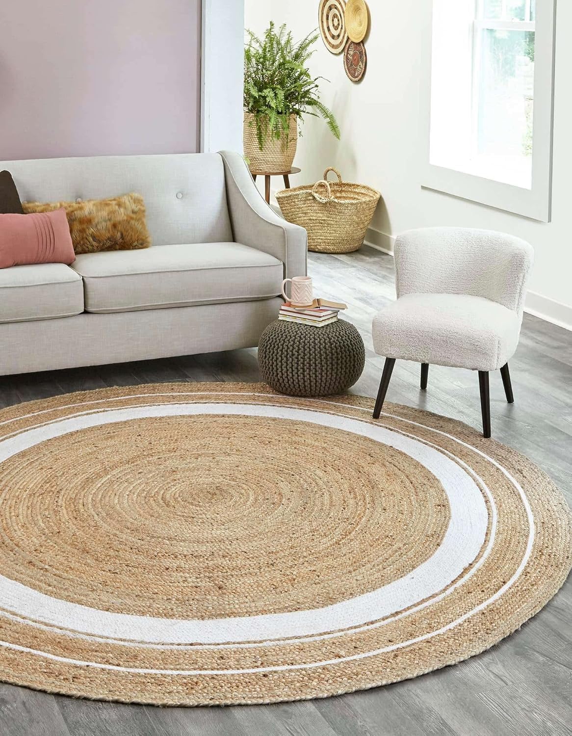 Round jute rug with white border in a living room setting