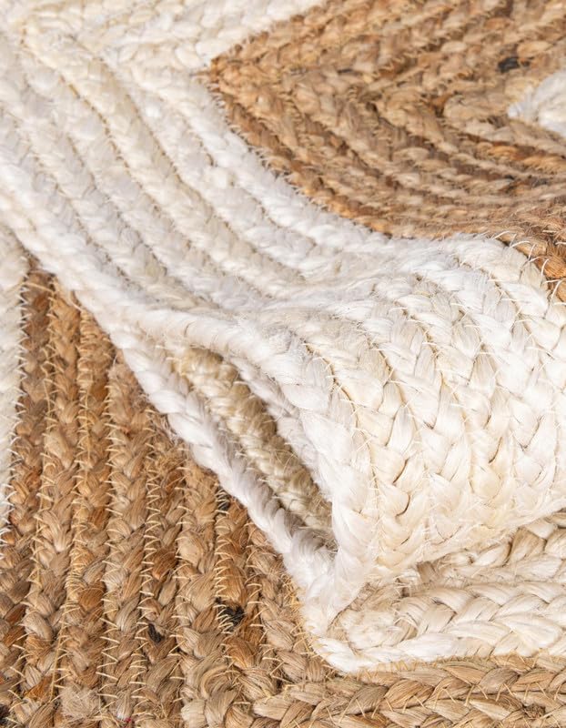 Handwoven jute area rug in natural tones, featuring textured braids and a cozy, rustic design.