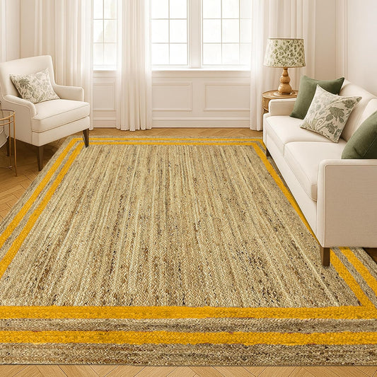 Living room with a large beige rug featuring yellow stripes, white sofa, and armchair.