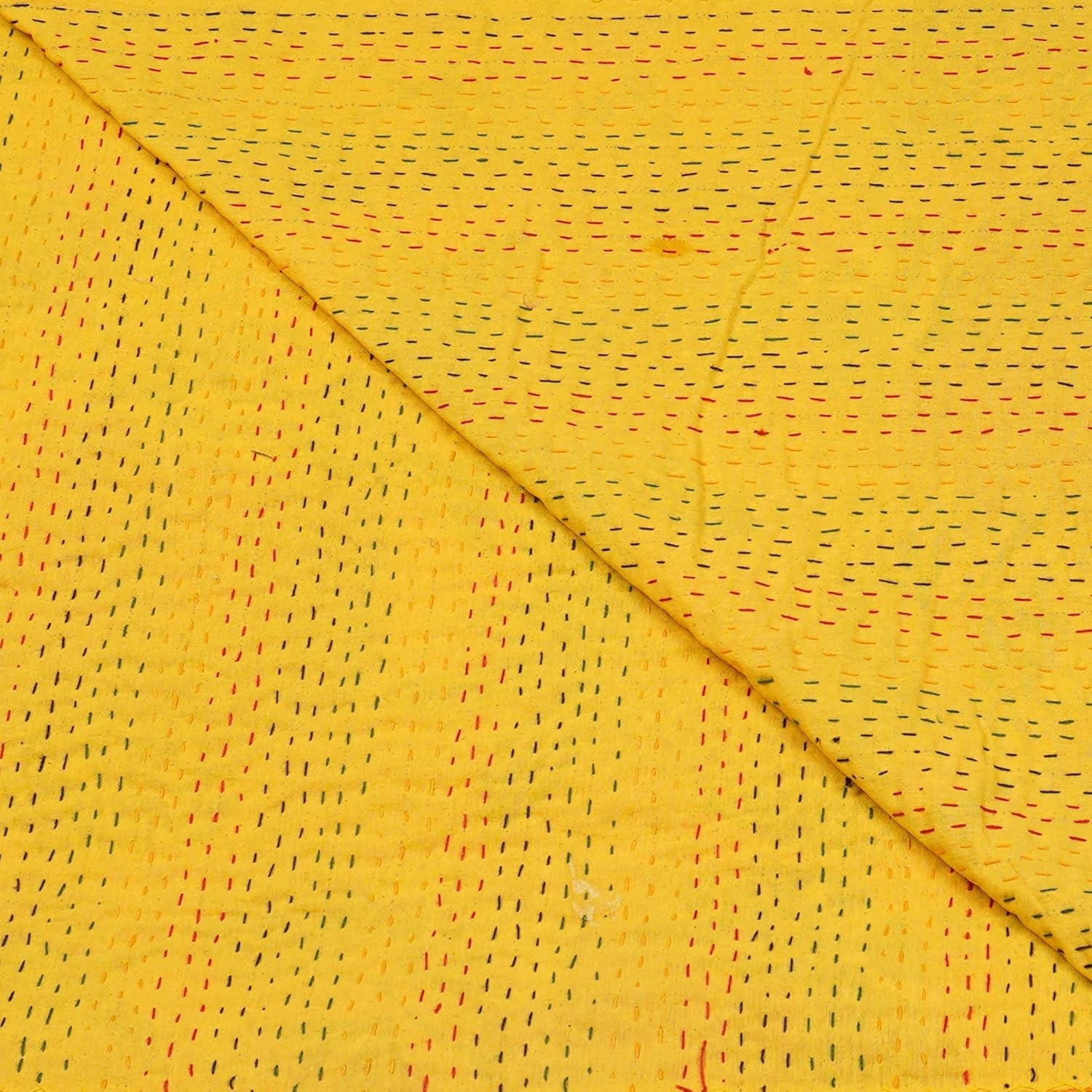 Yellow Kantha bedcover by Handmade, featuring short, colorful stitched detailing and a folded texture.
