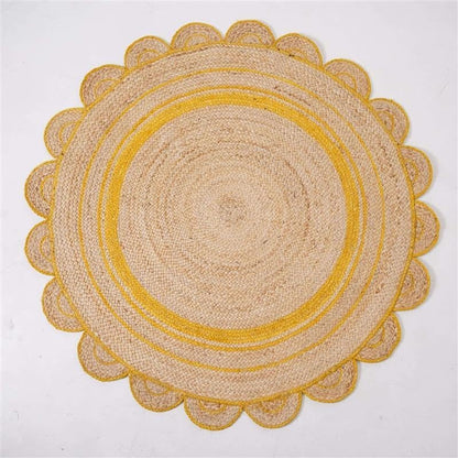 A round natural jute placemat with a scalloped edge and concentric yellow stripes, photographed flat against a white background.