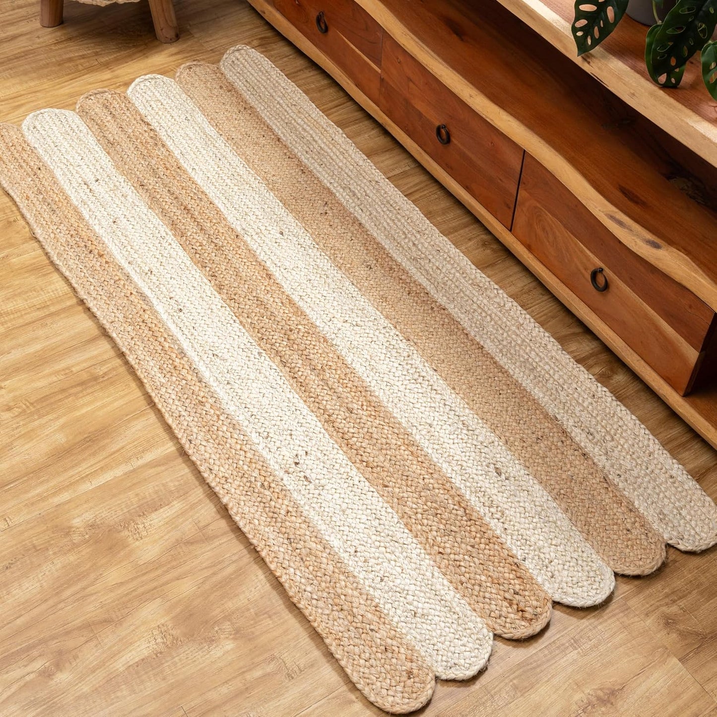 Set of woven mats on a wooden floor with a wooden cabinet in the background.