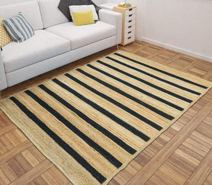 Striped area rug on a wooden floor with a white sofa in the background