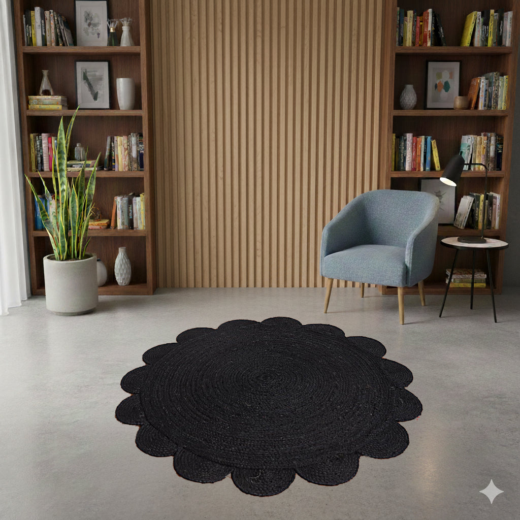 Black round rug in a living room with bookshelves, a chair, and a plant.
