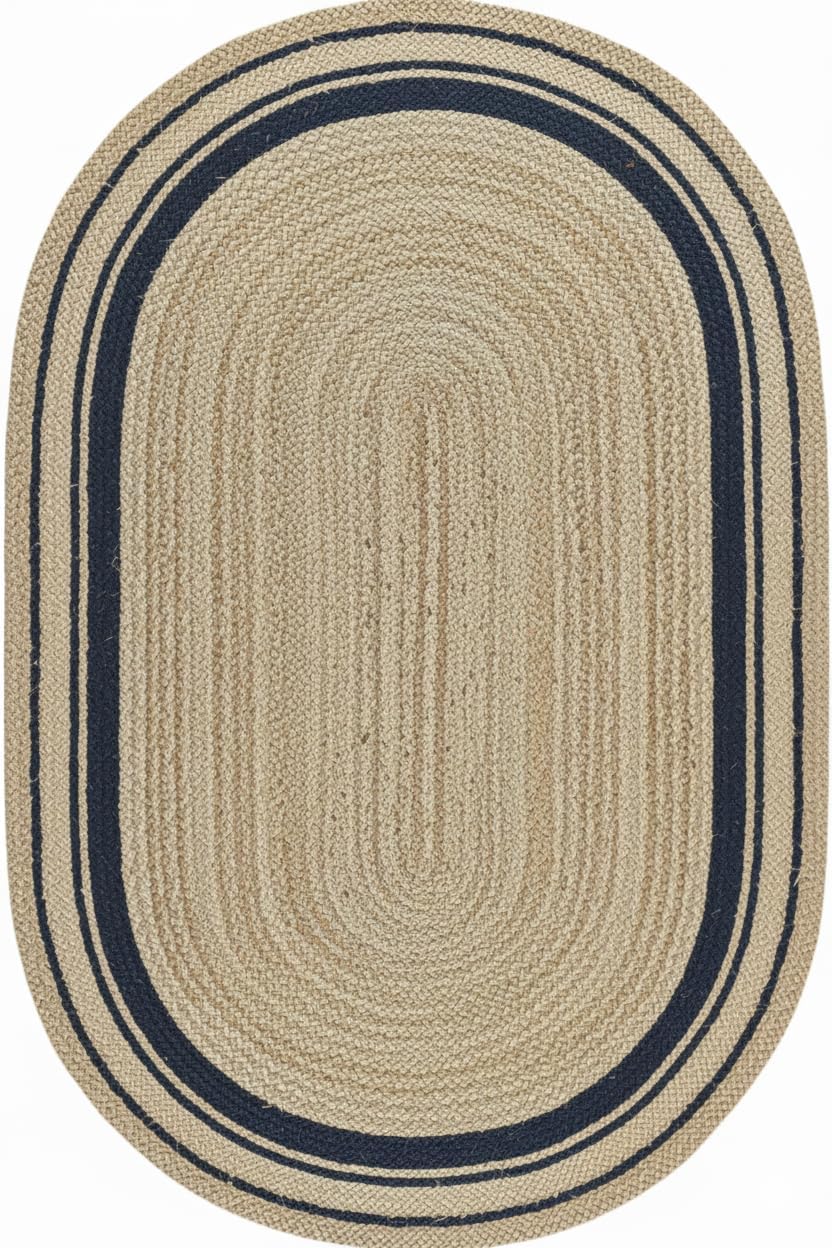 Oval braided rug with beige center and navy border on a white background