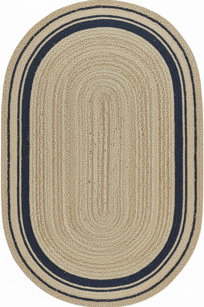 Oval braided rug with beige center and navy border on a white background