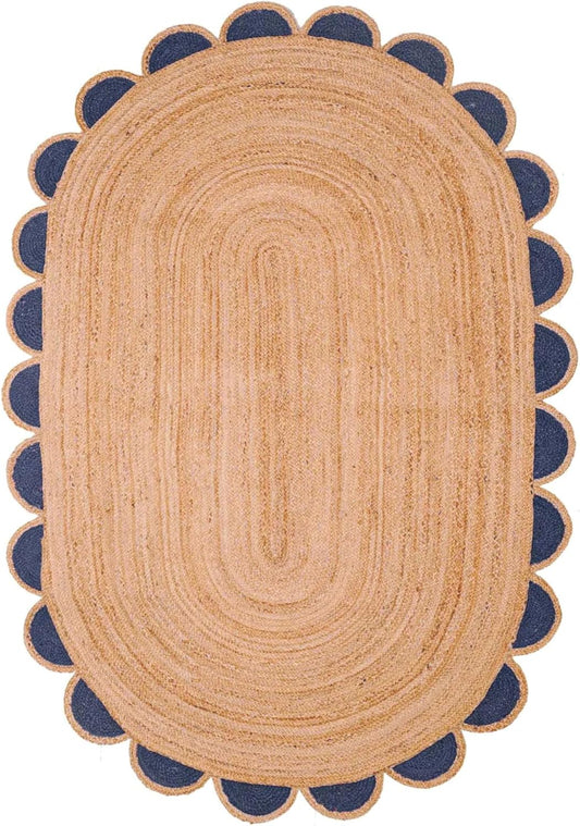 Oval jute area rug with navy blue scalloped edges, perfect for adding texture to home decor.