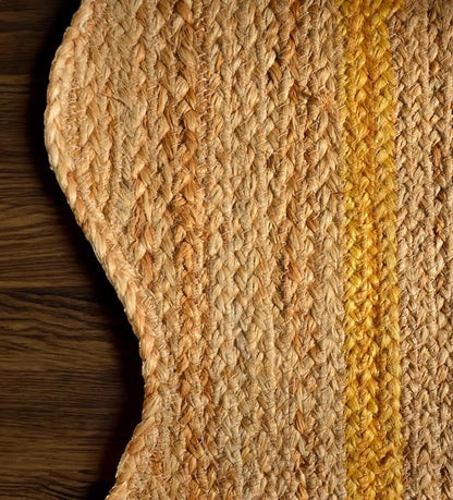 Close-up of a woven mat with a striped pattern on a wooden surface