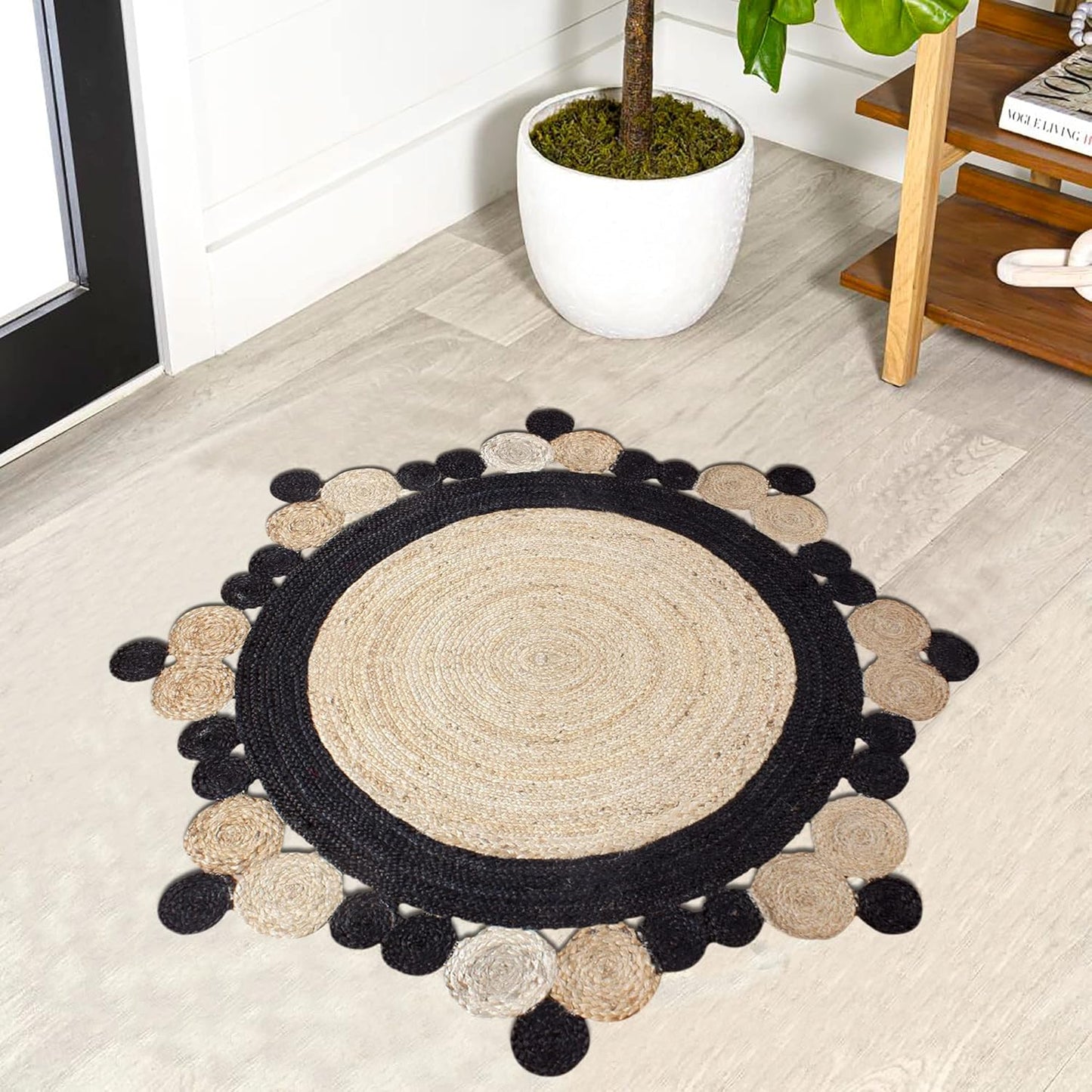 Natural Jute Area Rug with a round shape and scalloped edges, featuring a blend of beige and black tones.