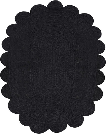 Black scalloped placemat on a white background