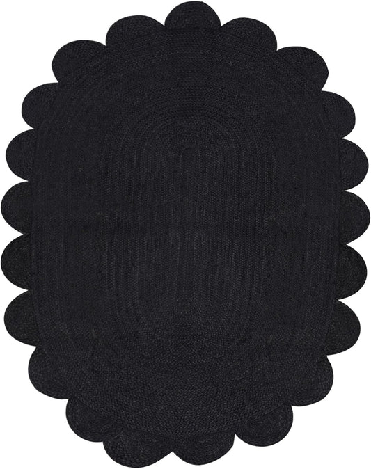 Black scalloped placemat on a white background