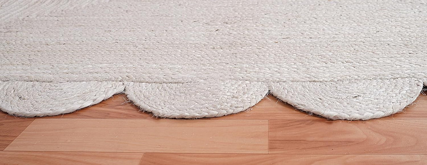 Close-up of a textured white rug on a wooden floor