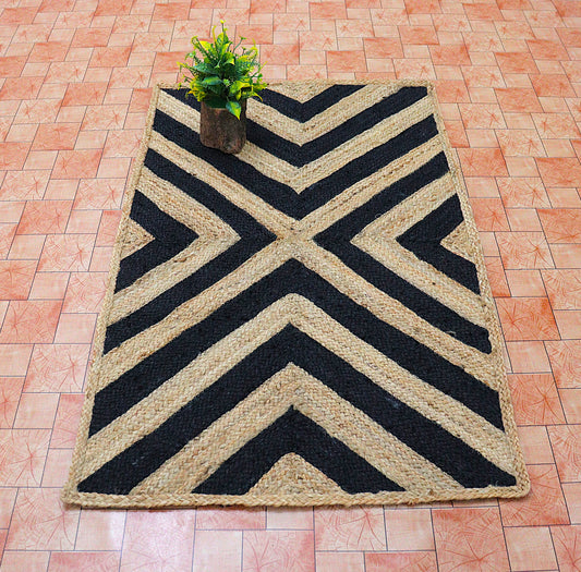 Black and beige chevron patterned rug on a tiled floor