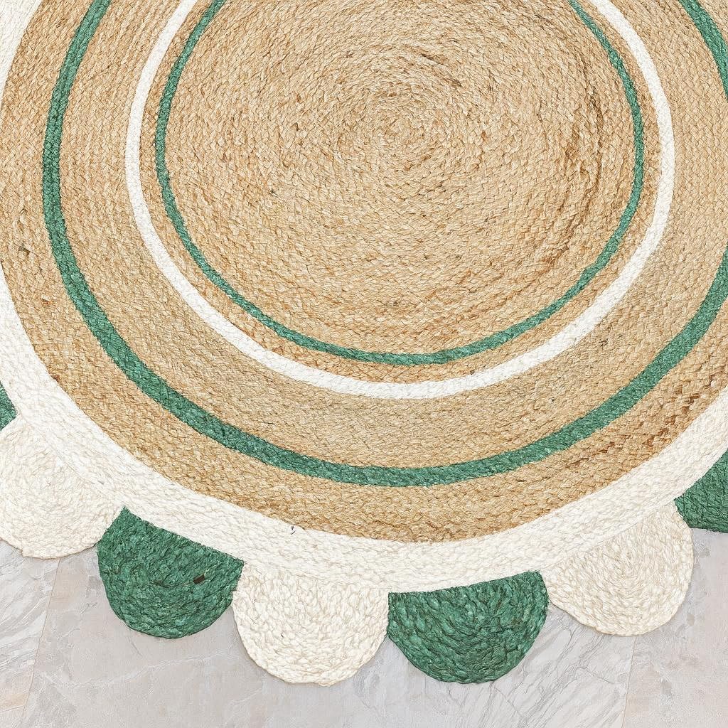 Natural Jute Area Rug in a round shape with scalloped edges, featuring earthy tones of green and beige for a textured finish.