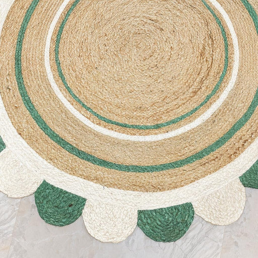 Natural Jute Area Rug in a round shape with scalloped edges, featuring earthy tones of green and beige for a textured finish.