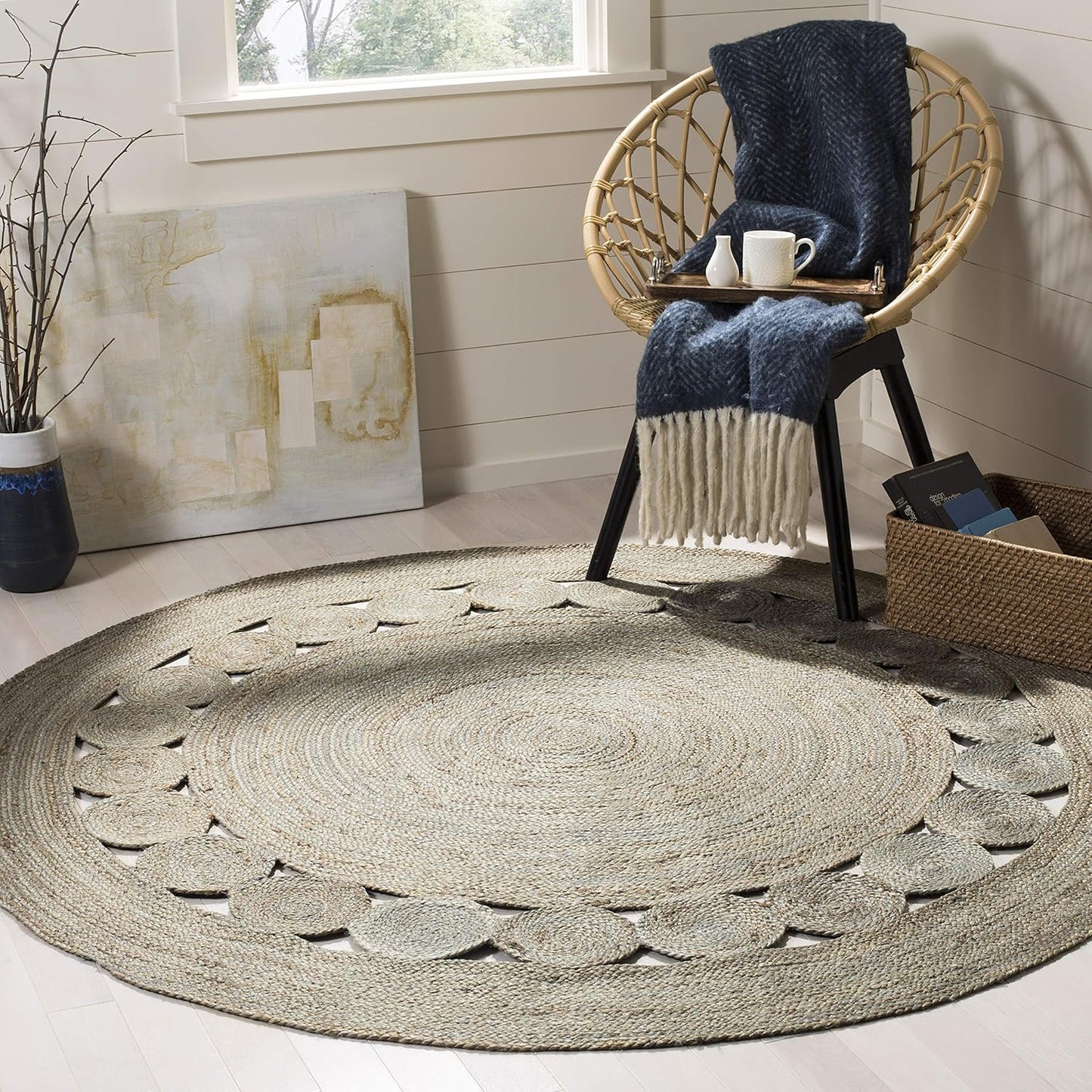 Natural woven round area rug with cut-out pattern, beige color, ideal for modern home decor.