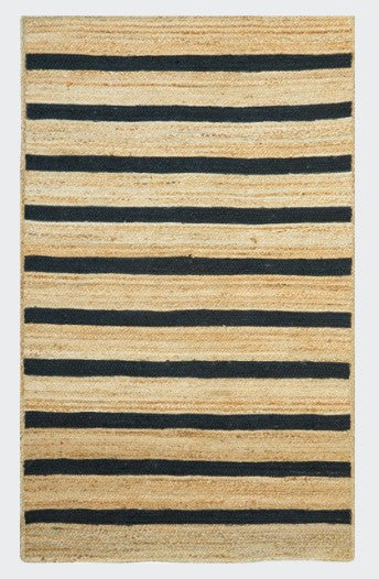 Beige and black striped rug on a white background