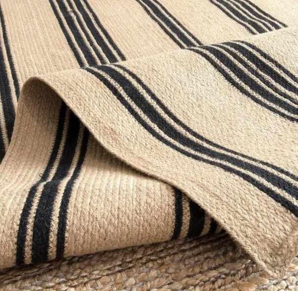 Close-up of a textured fabric with beige and navy stripes