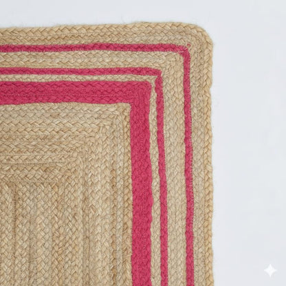 Woven rug with red border on a white background