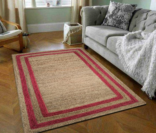 Beige rug with red border in a living room setting