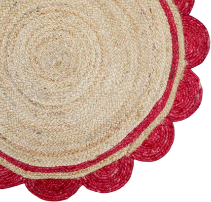 Round jute rug with red scalloped edge on a white background