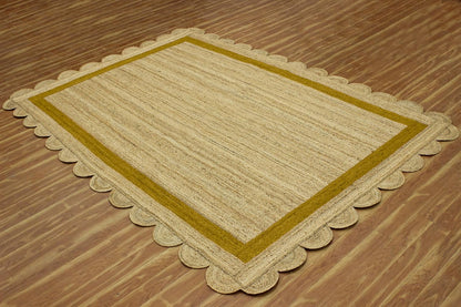Natural Jute Area Rug with a scalloped edge in earthy tones—perfect for adding texture to any living space.